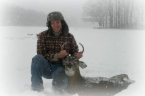 man holding deer