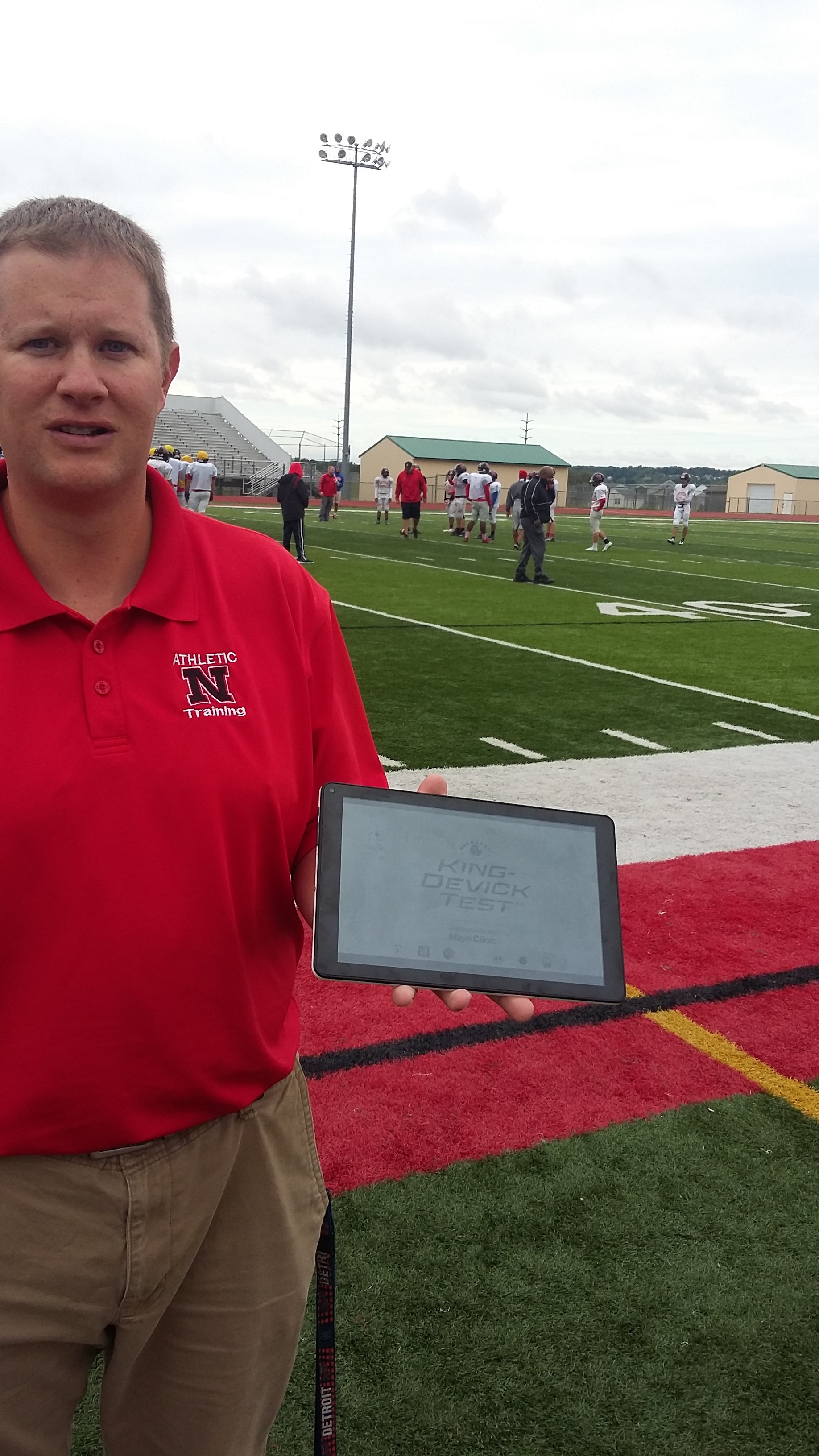 Northview High School athletic trainer Jesse Brinks tests athletes for concussion with a specialized iPad program. (Photo courtesy Northview High School). 